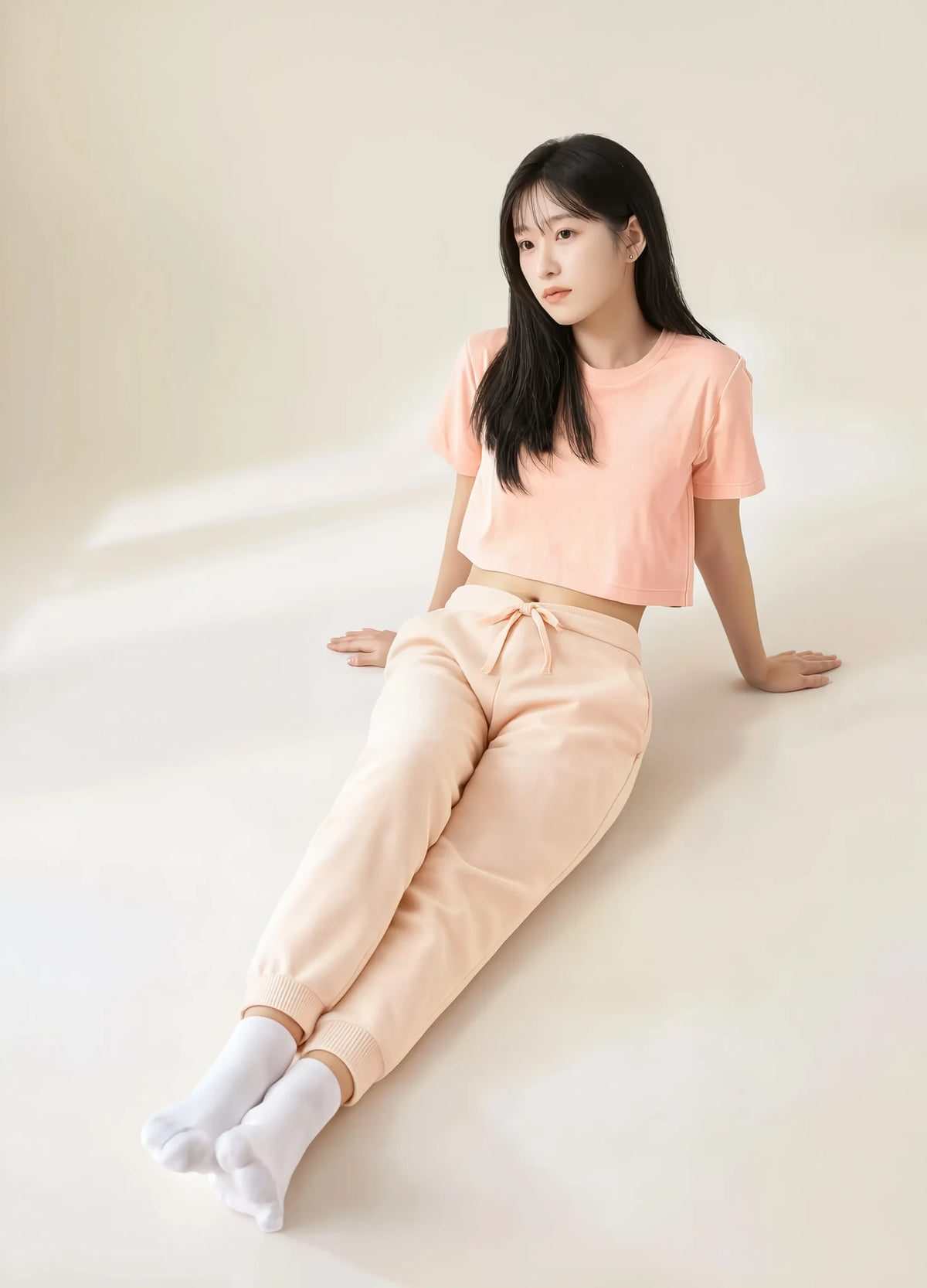 nabi Signature Crop Tee in Peach Faded (faded peach), worn as a set with the Wash Sweatpants