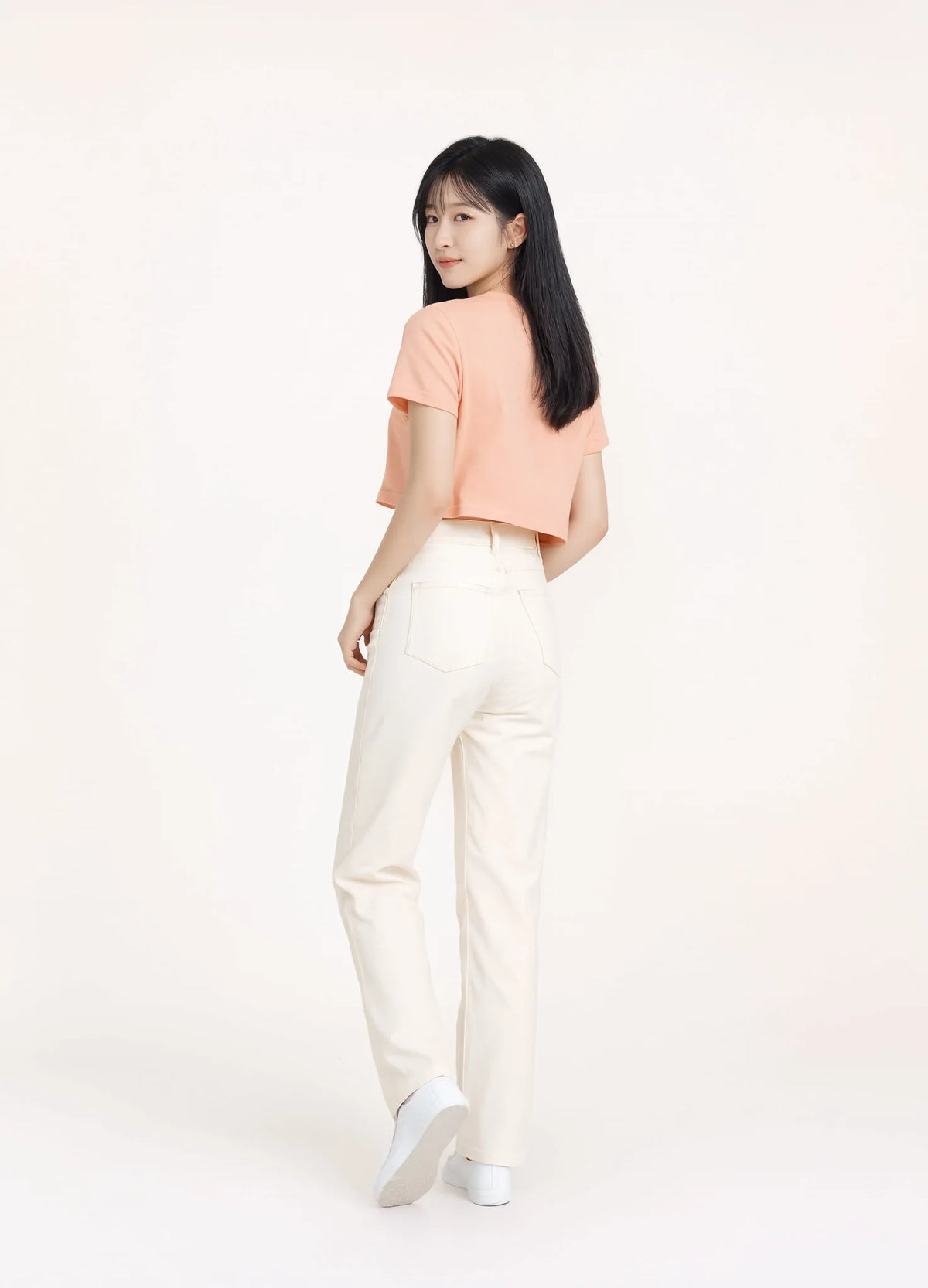 nabi Signature Crop Tee in Peach Faded (faded peach), back view on model