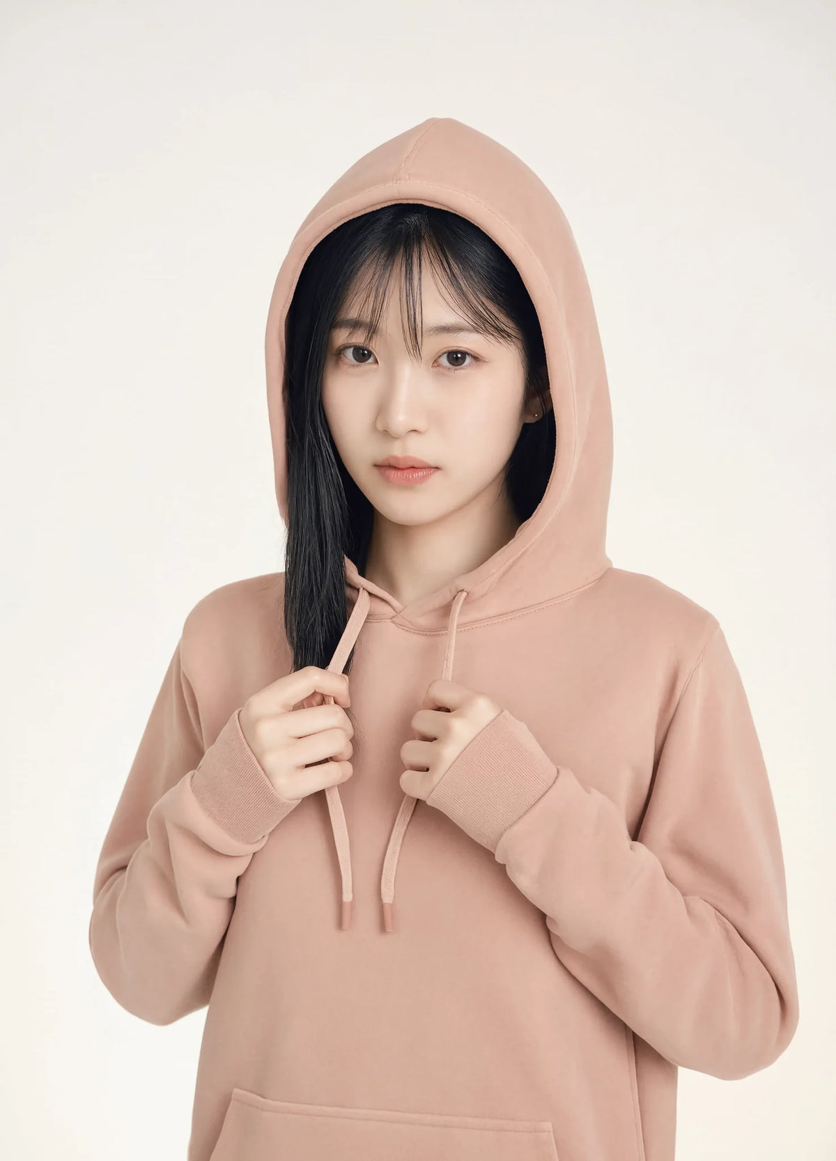 nabi Pigment-Dyed Hoodie in Peach Faded (faded peach), hood up, portrait