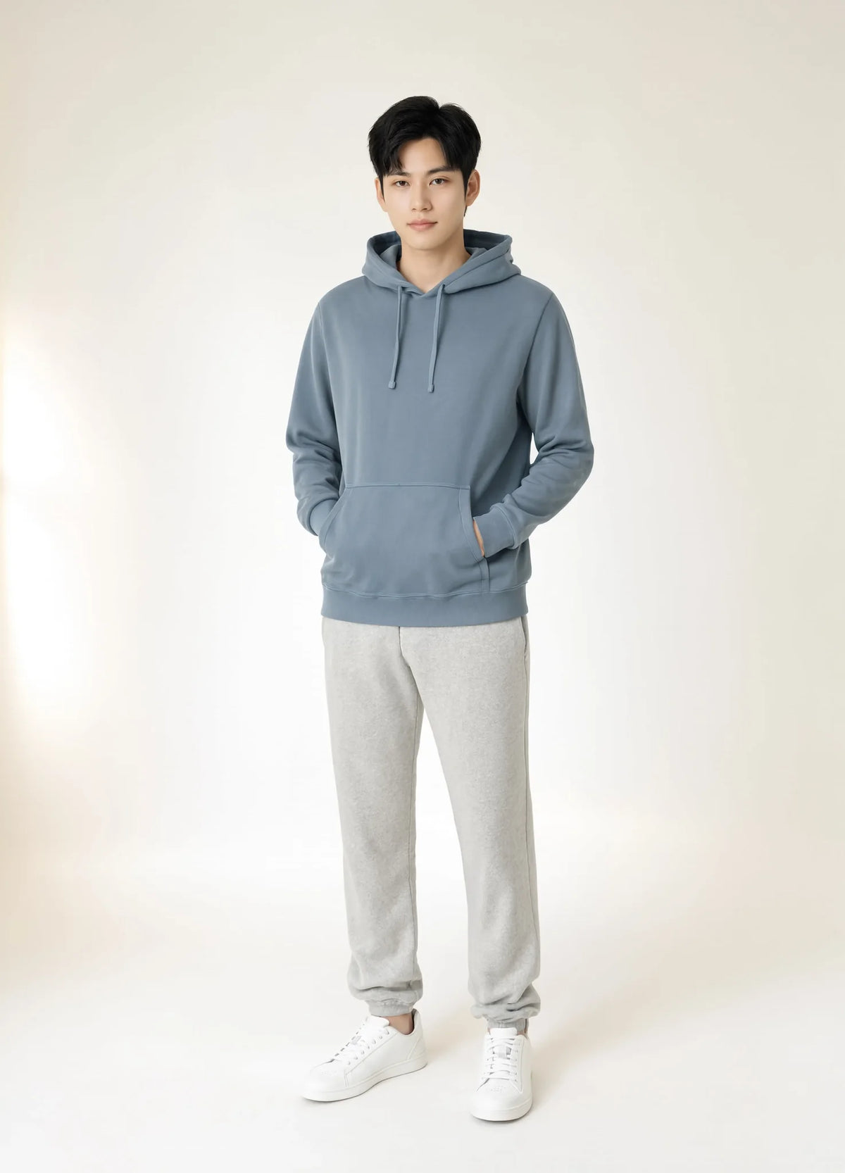 nabi Pigment-Dyed Hoodie in Washed Chambray (washed blue), unisex fit on a male model