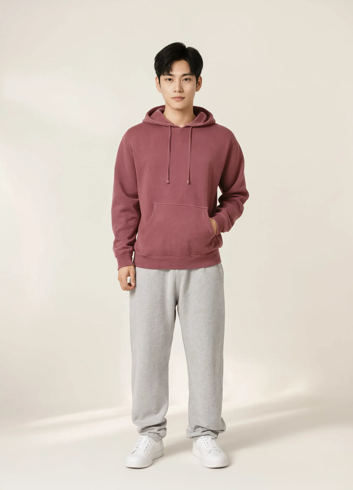 nabi Pigment-Dyed Hoodie in Ember Rose (dusty rose), unisex fit on a male model