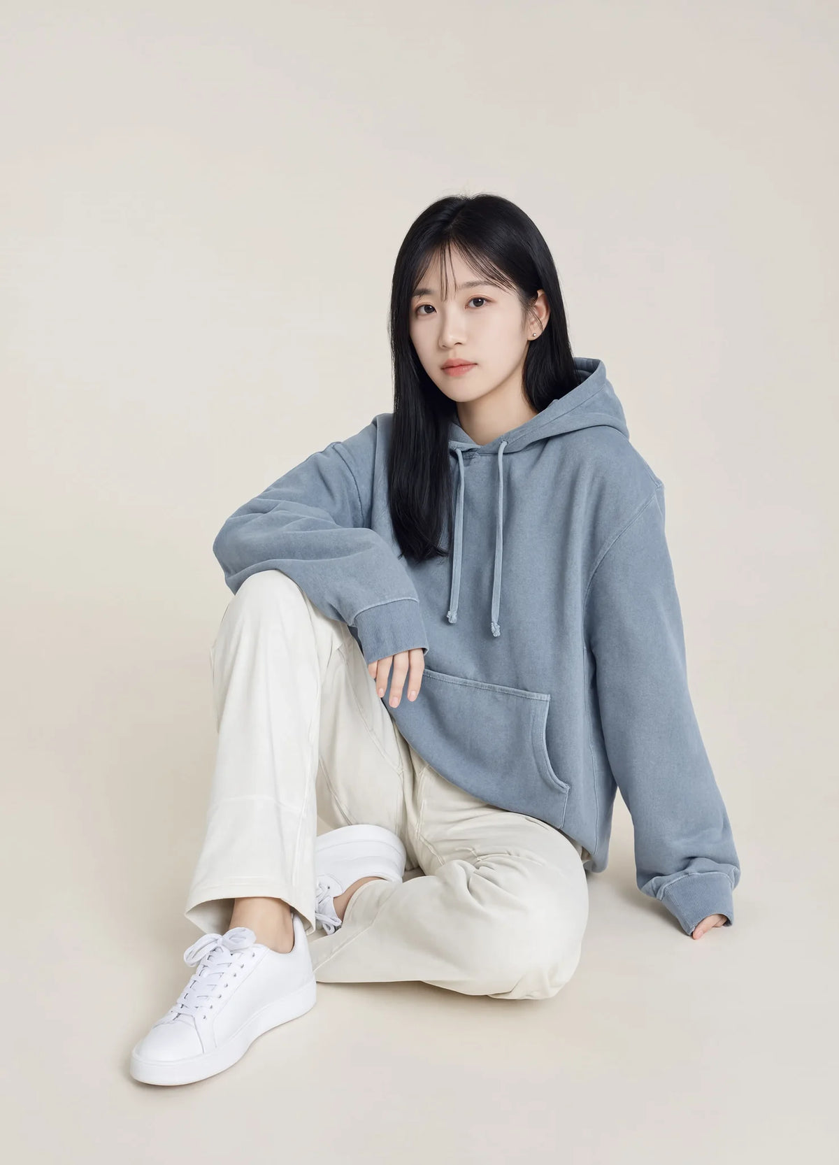 nabi Pigment-Dyed Hoodie in Washed Chambray (washed blue), seated, relaxed fit