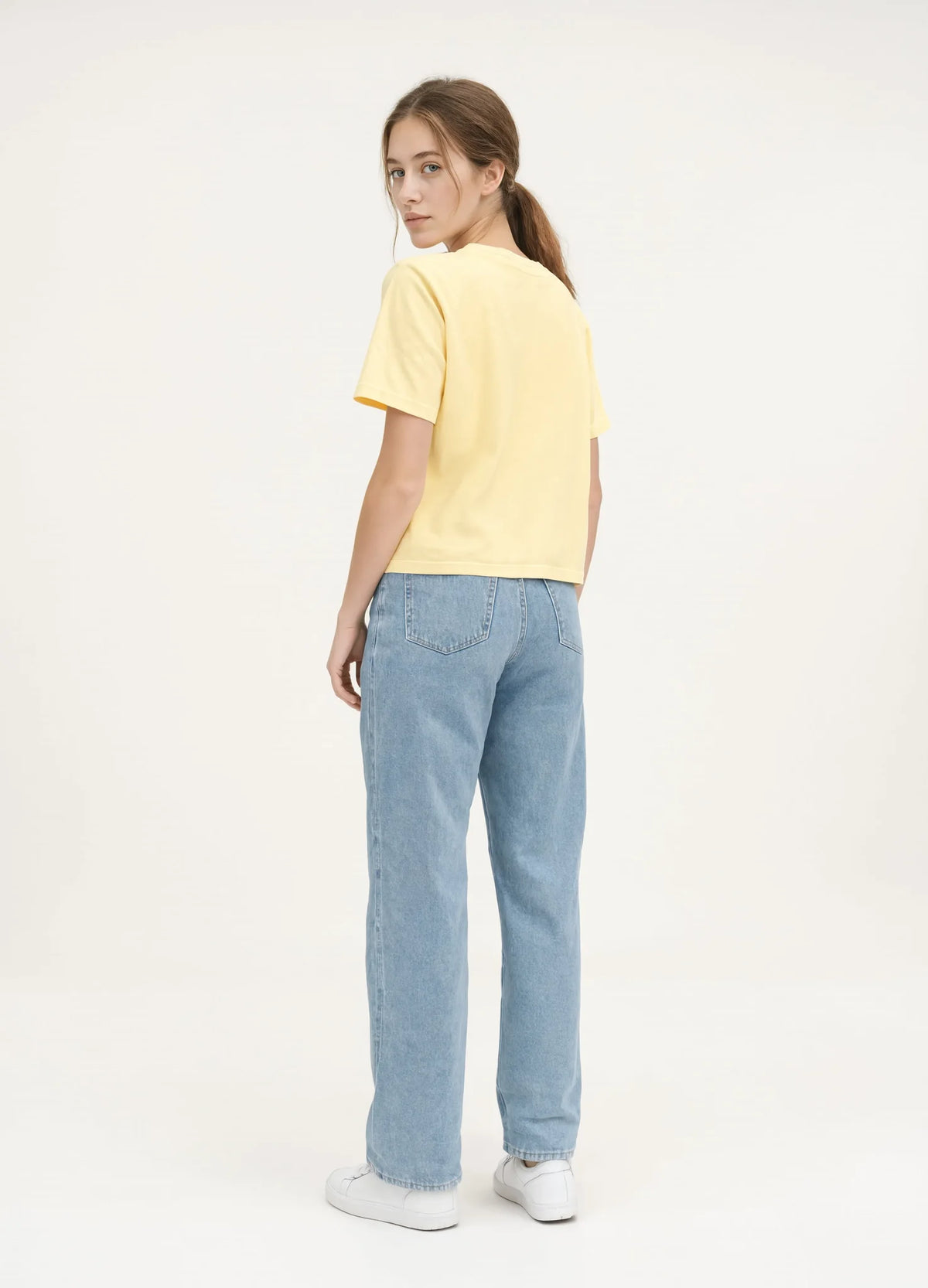 nabi Boxy Tee in Sunday Butter (soft butter yellow), back view on model