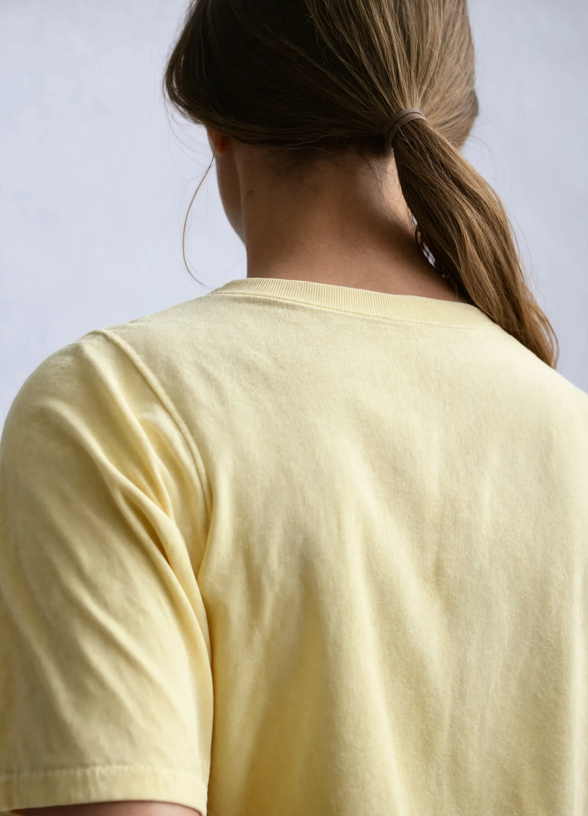 nabi Boxy Tee in Sunday Butter (soft butter yellow), back yoke detail