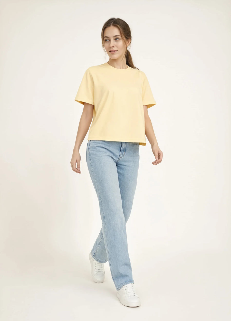 nabi Boxy Tee in Sunday Butter (soft butter yellow), front view on model