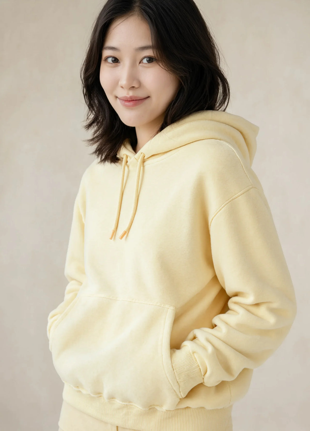 nabi Pullover Hoodie in Sunday Butter (soft butter yellow), ribbed waistband detail