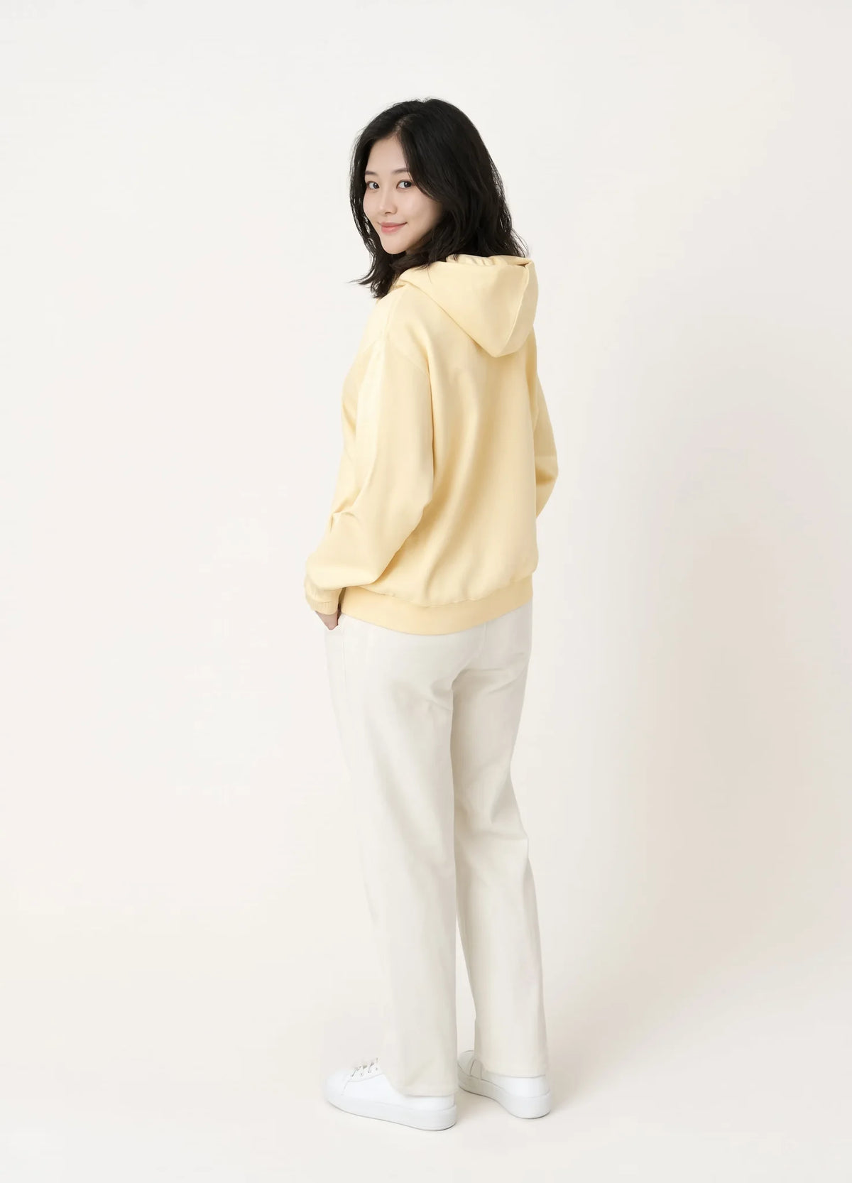 nabi Pullover Hoodie in Sunday Butter (soft butter yellow), back view on model