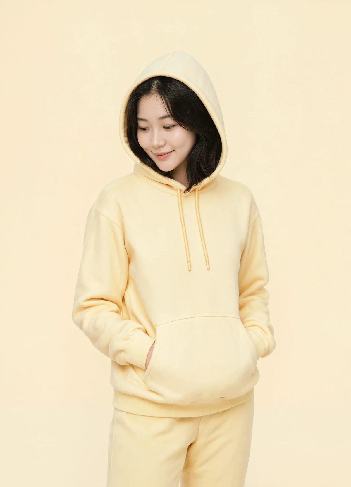 nabi Pullover Hoodie in Sunday Butter (soft butter yellow), tonal study, hood up