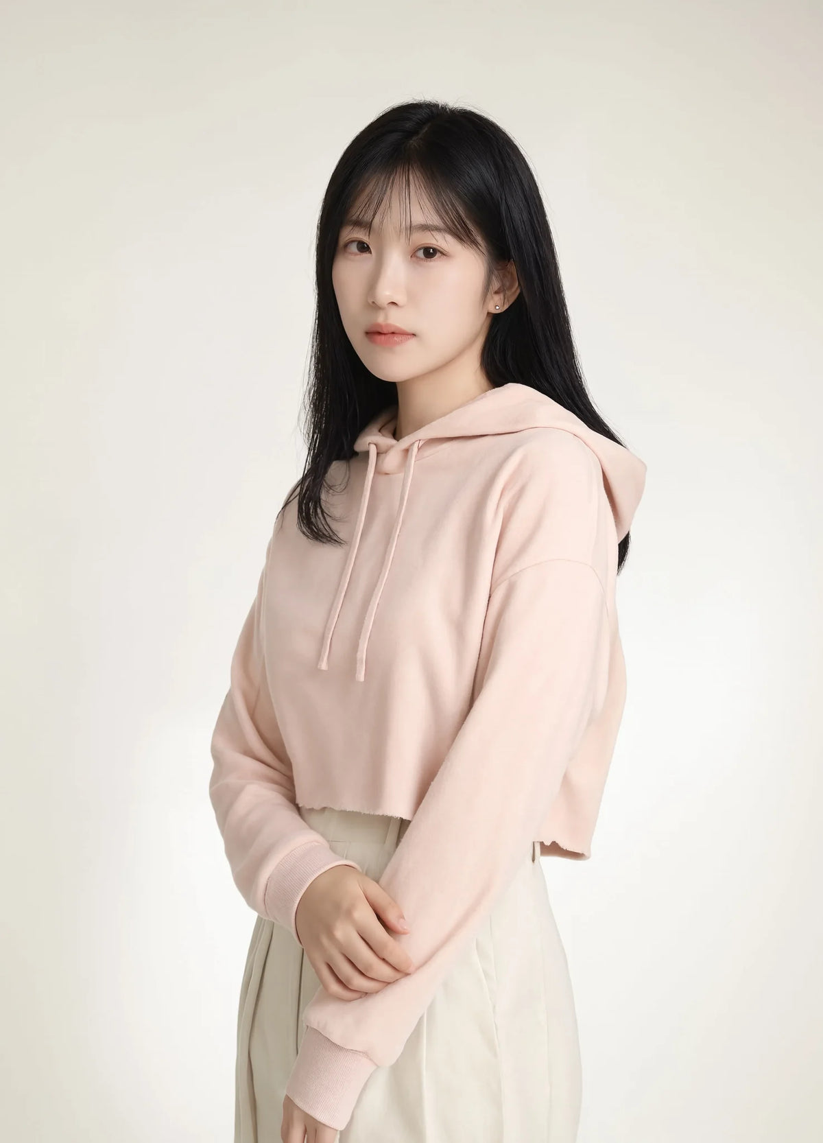 nabi Cropped Hoodie in Underwing (pale pink), three-quarter view on model