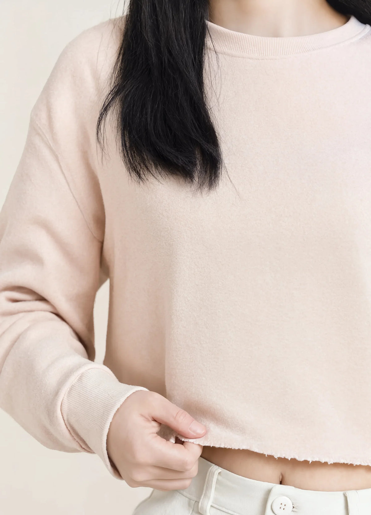 nabi Cropped Crew Sweatshirt in Underwing (pale pink), raw-edge hem and fleece detail
