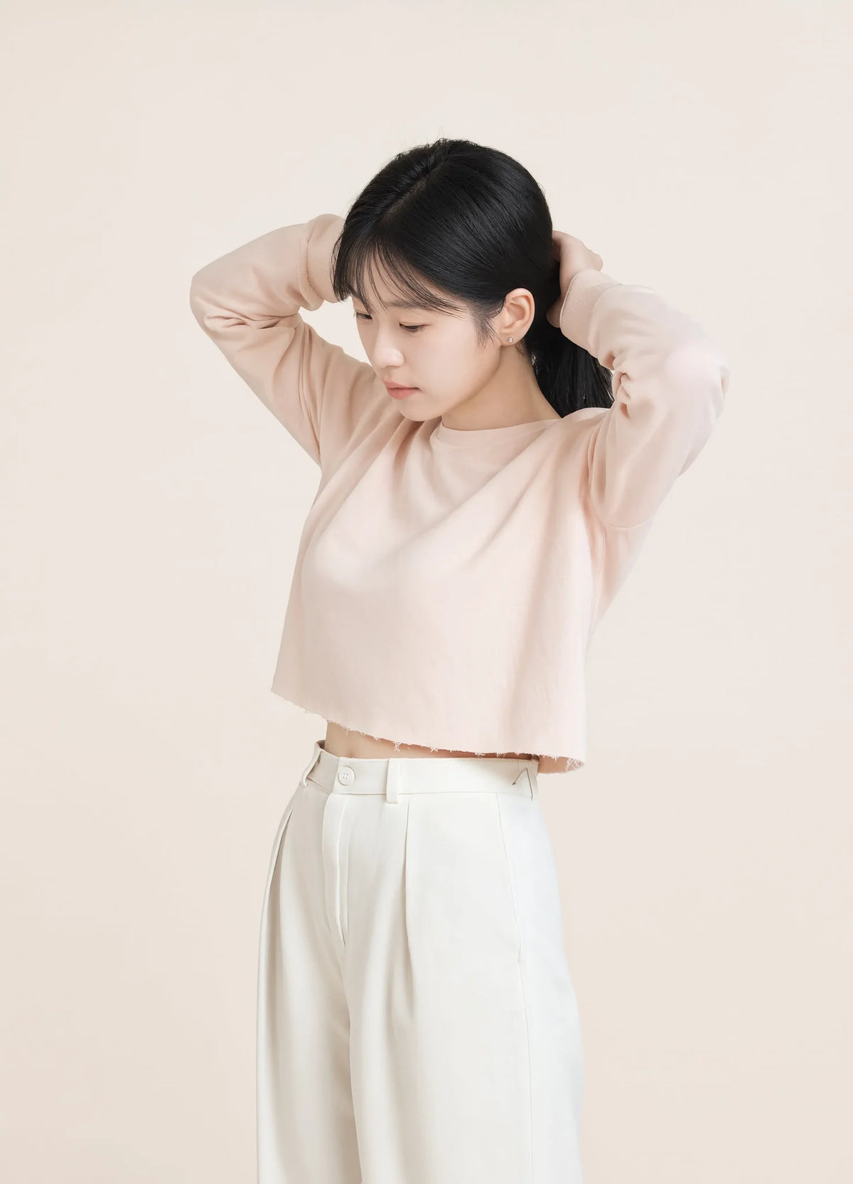 nabi Cropped Crew Sweatshirt in Underwing (pale pink), three-quarter view on model