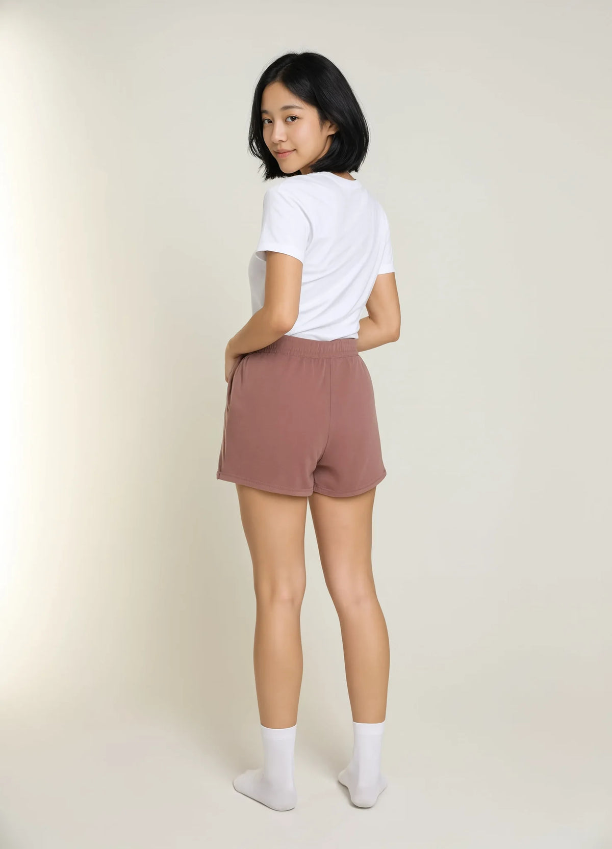 nabi Sweat Shorts in Ember Rose (dusty rose), back view on model