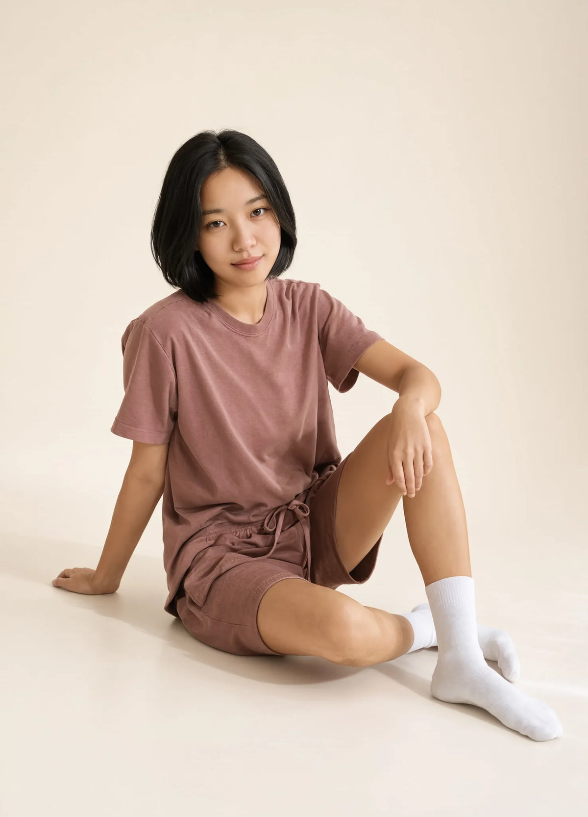 nabi Sweat Shorts in Ember Rose (dusty rose), set look, seated on the floor