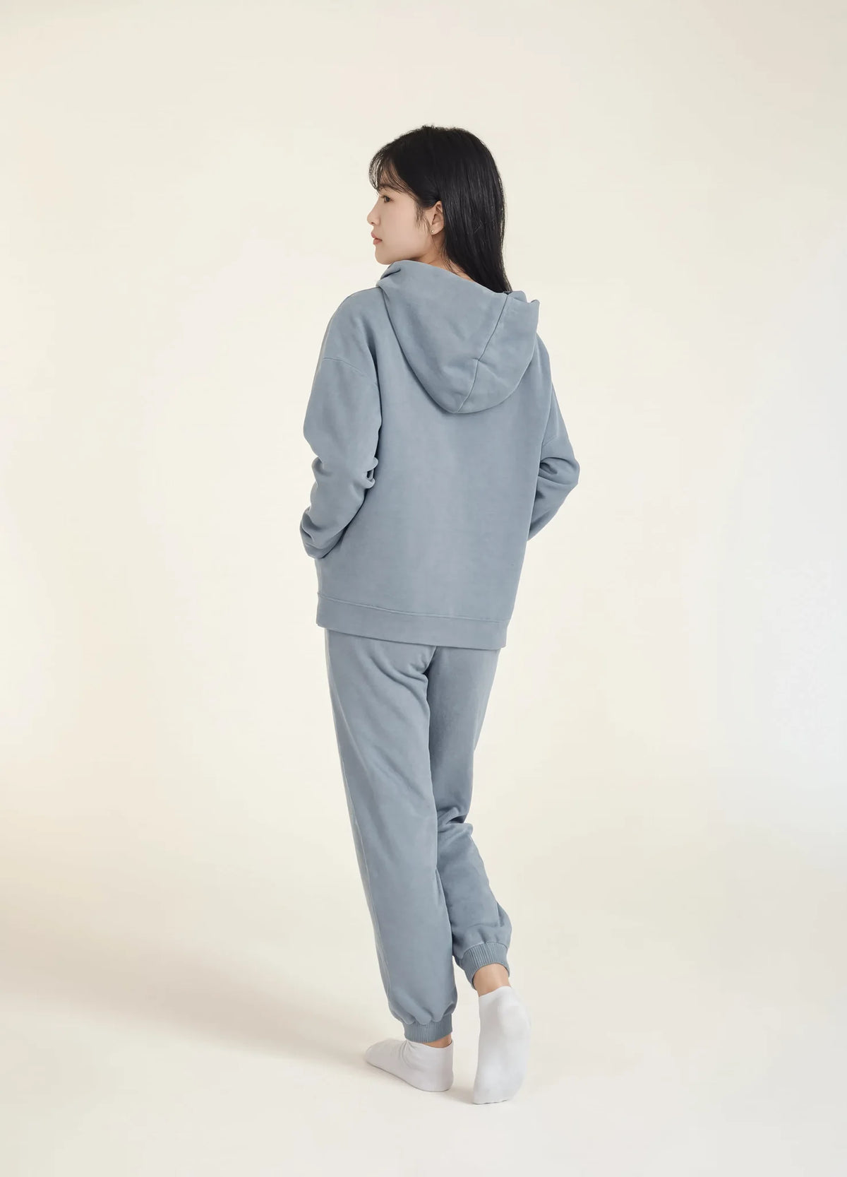 nabi Wash Sweatpants in Washed Chambray (washed blue), worn as a set with the Pigment Hoodie, back view