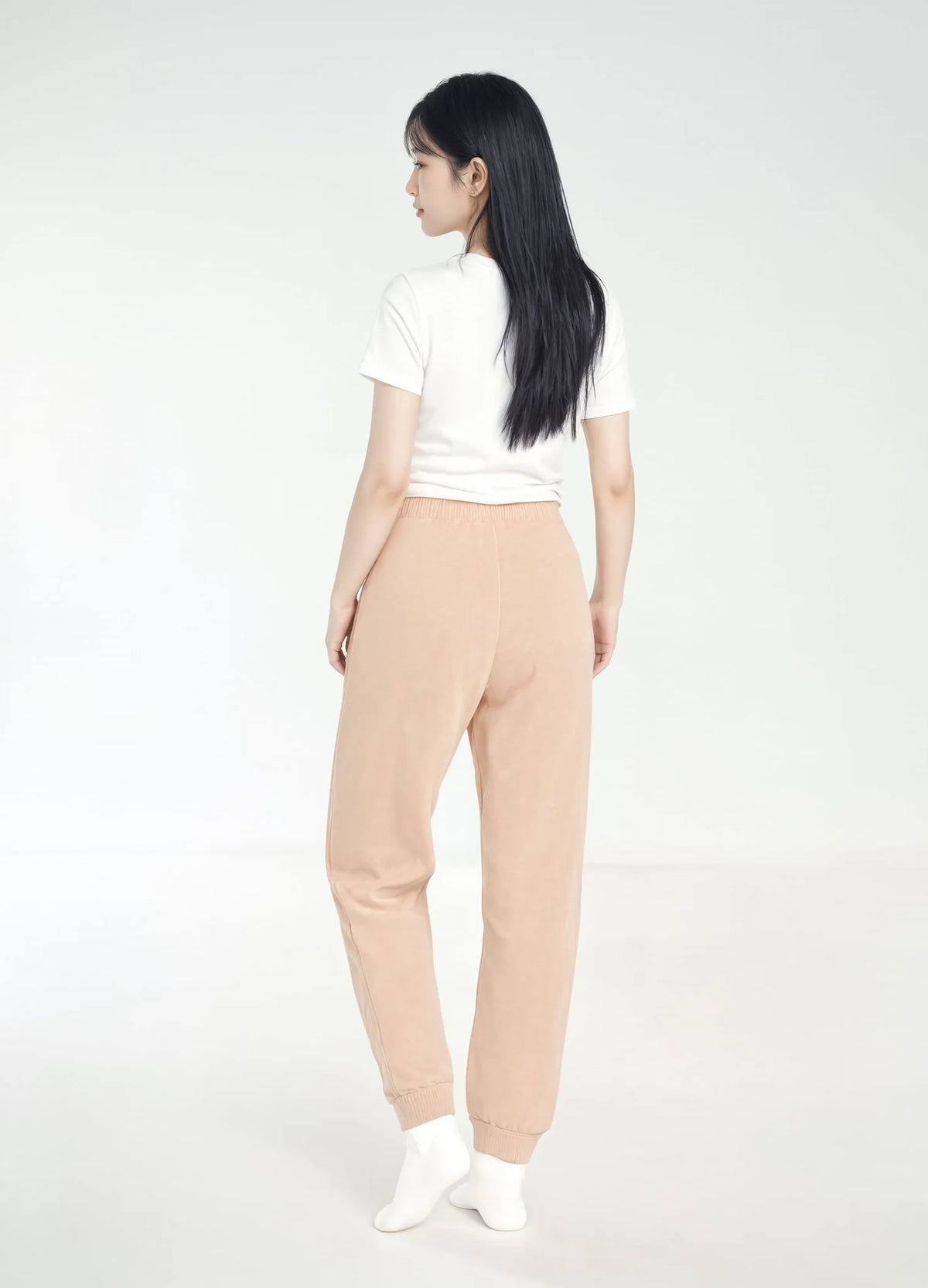 nabi Wash Sweatpants in Peach Faded (faded peach), back view on model