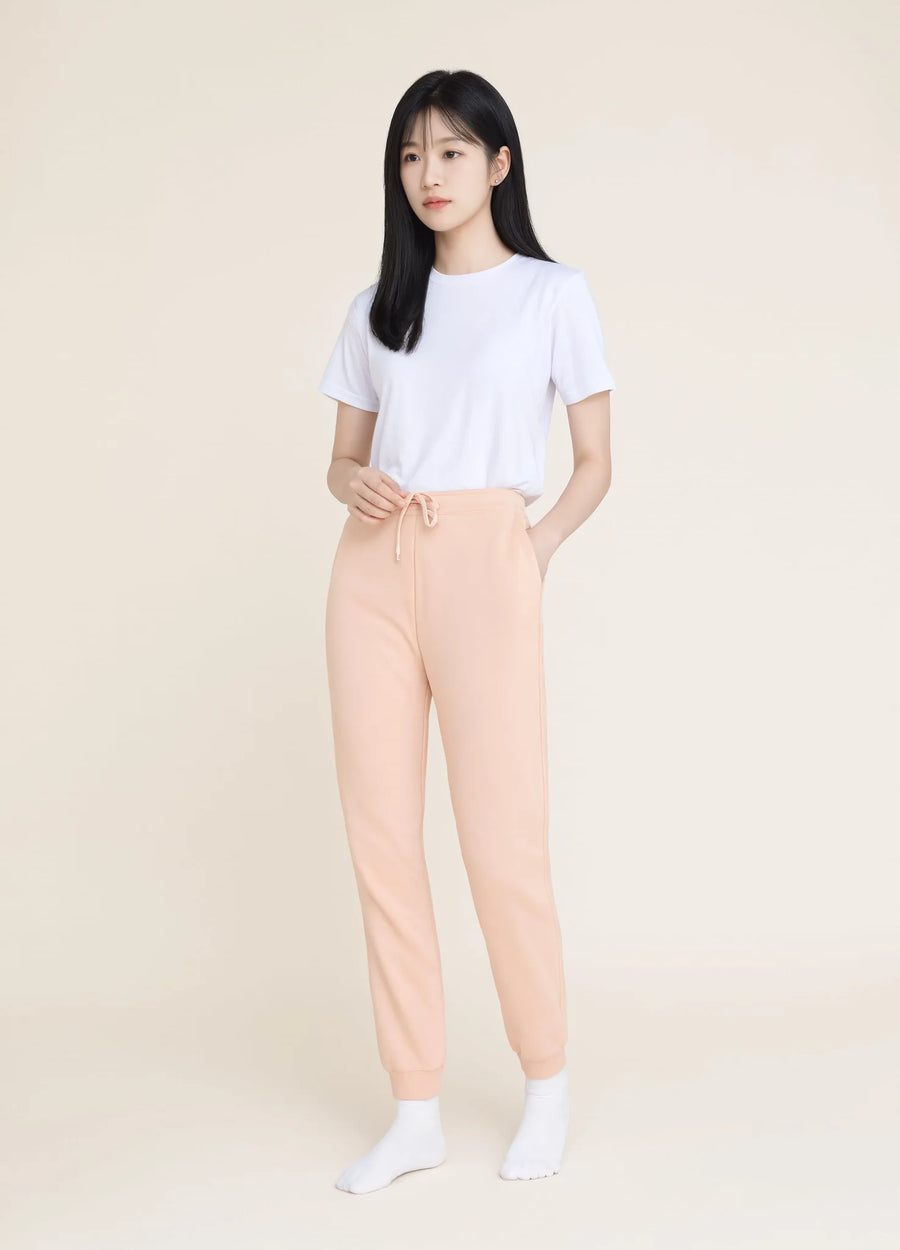 nabi Wash Sweatpants in Peach Faded (faded peach), front view on model