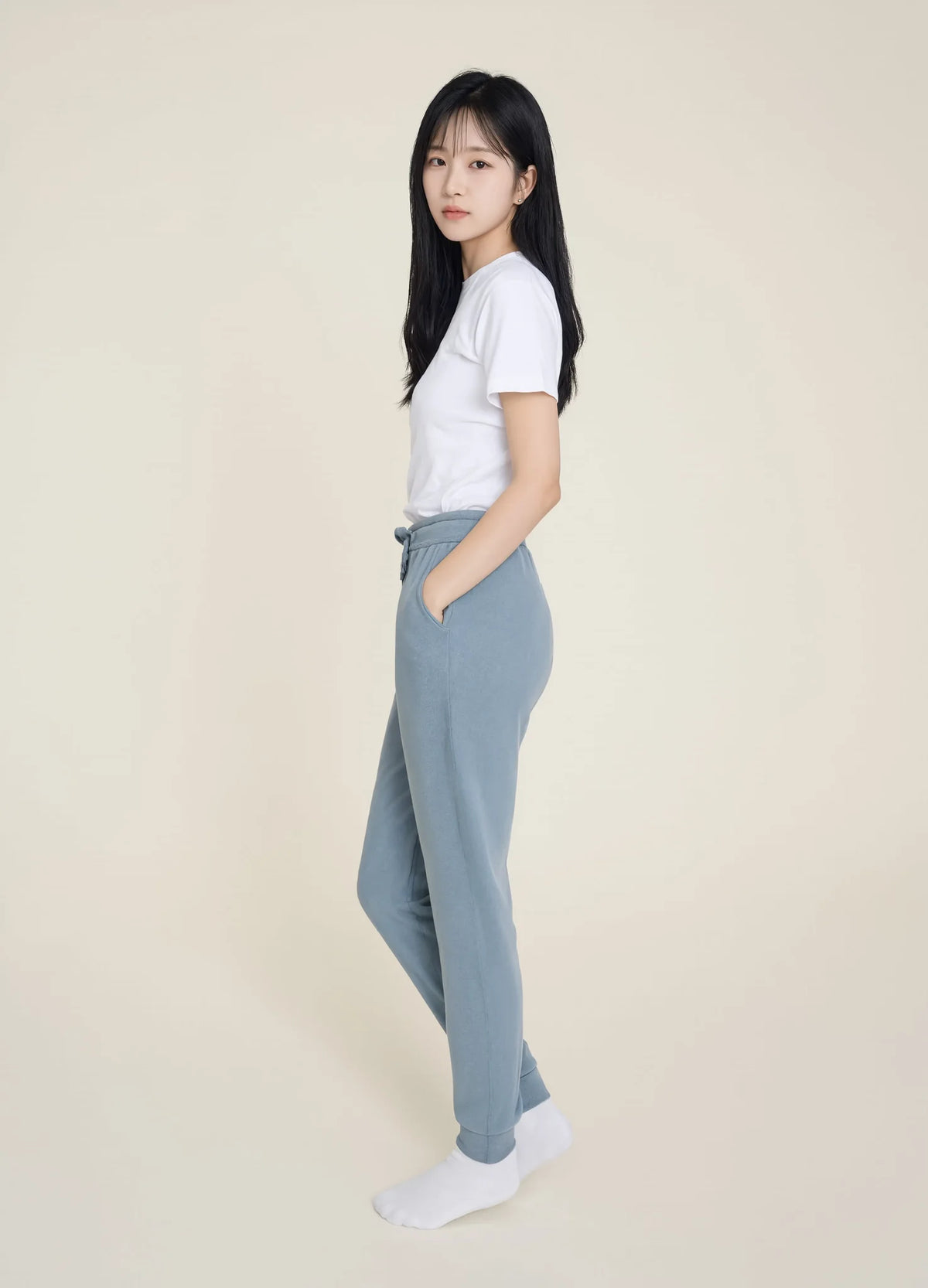 nabi Wash Sweatpants in Washed Chambray (washed blue), three-quarter view on model