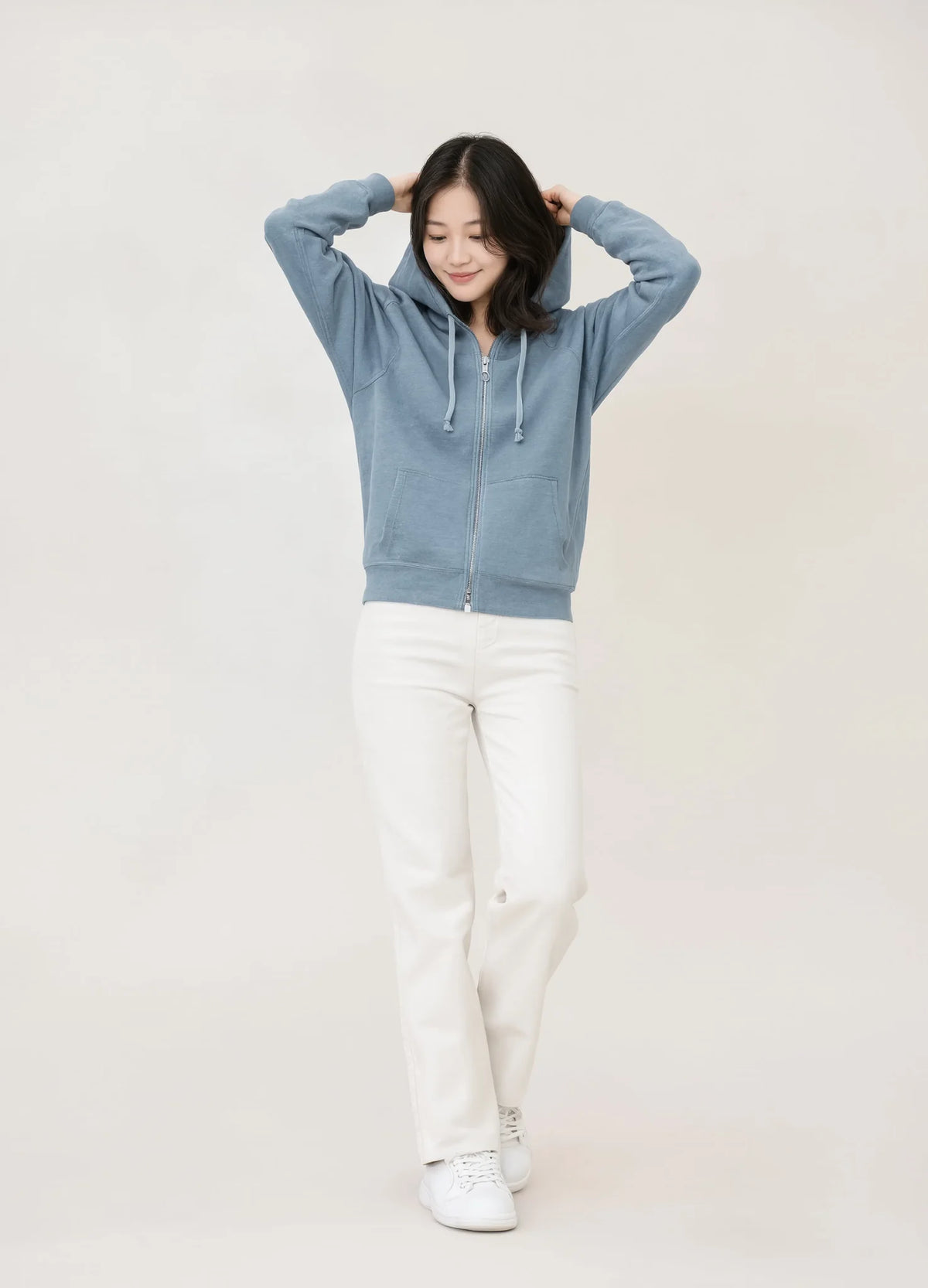 nabi Wash Zip Hoodie in Washed Chambray (washed blue), front view on model